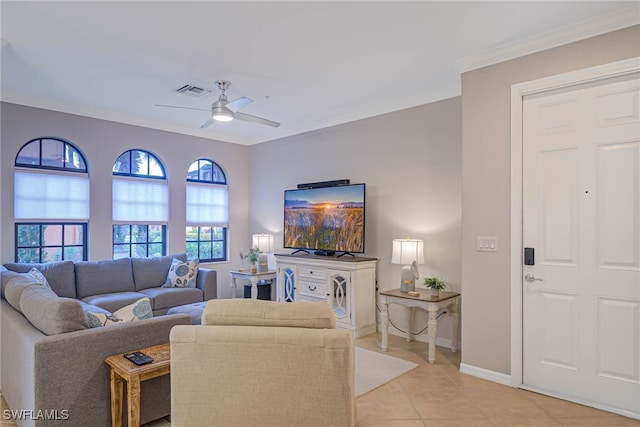 living room with ceiling fan, light tile patterned flooring, and crown molding