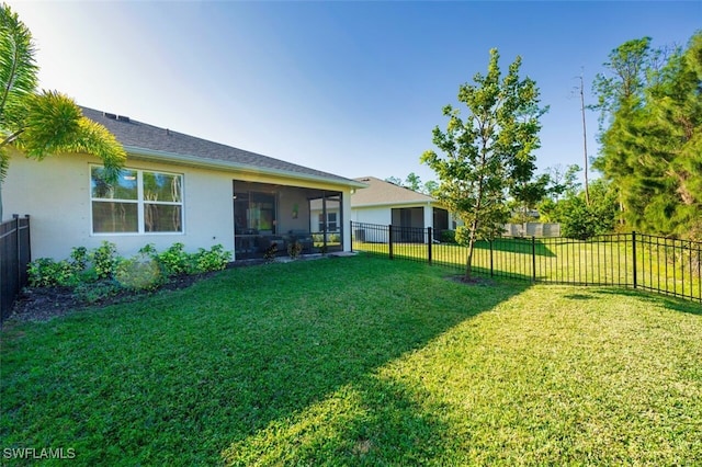 view of yard with a sunroom