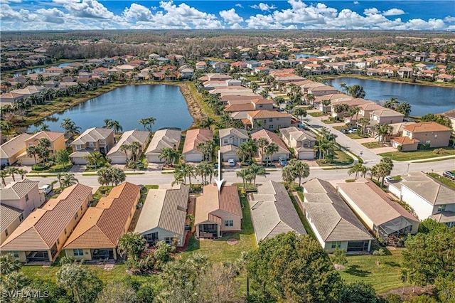 drone / aerial view with a water view