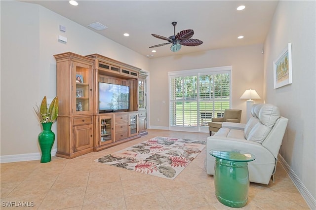 tiled living room featuring ceiling fan