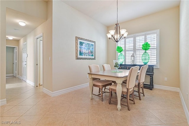 dining room featuring an inviting chandelier and light tile patterned flooring