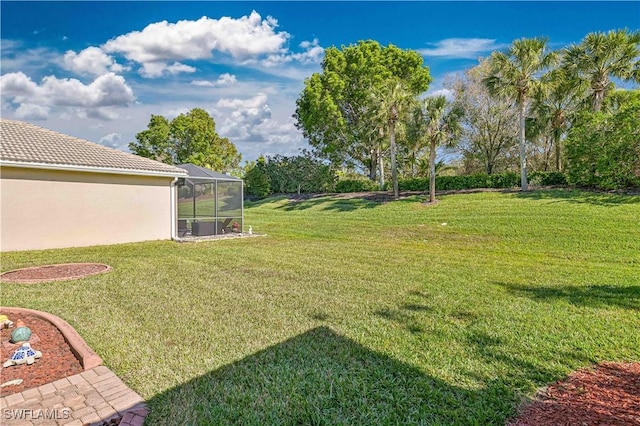 view of yard featuring glass enclosure