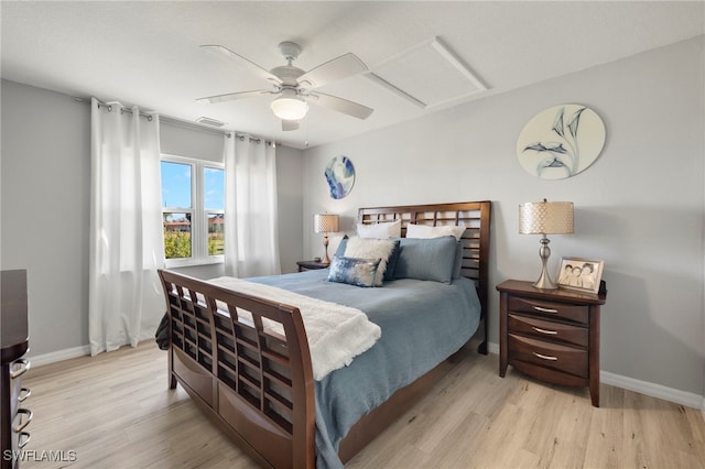 bedroom with light hardwood / wood-style flooring and ceiling fan