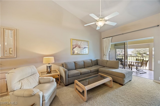 living room featuring ceiling fan, light tile patterned flooring, and lofted ceiling