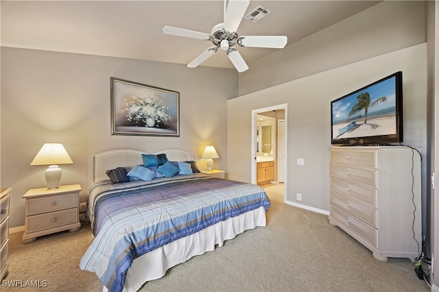 carpeted bedroom featuring ensuite bath, ceiling fan, and lofted ceiling