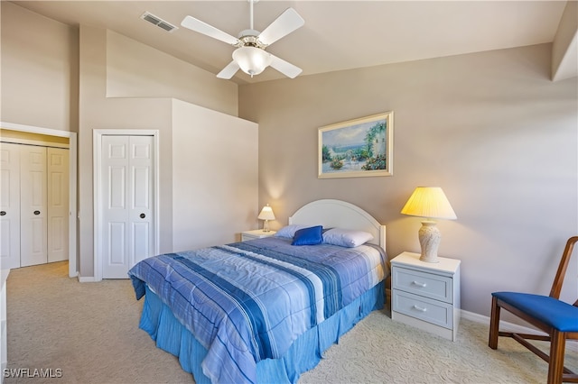 carpeted bedroom with ceiling fan and lofted ceiling