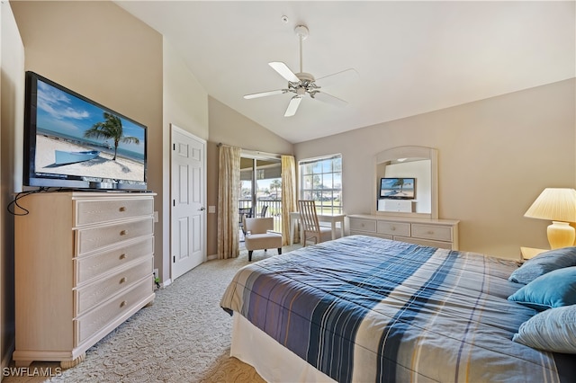 bedroom featuring light colored carpet, vaulted ceiling, and ceiling fan