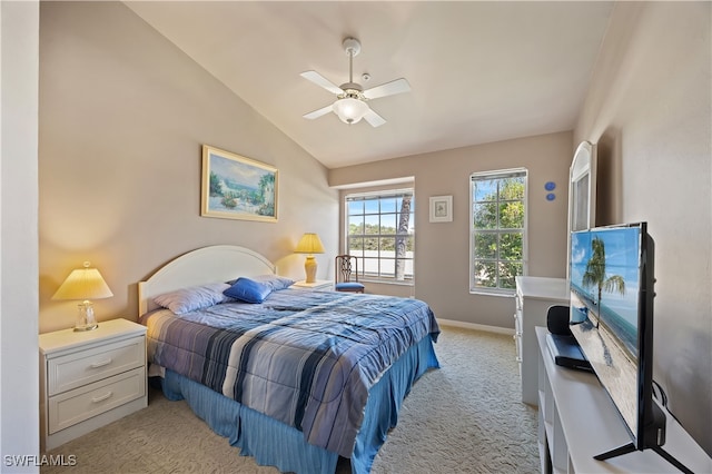 carpeted bedroom featuring ceiling fan and lofted ceiling