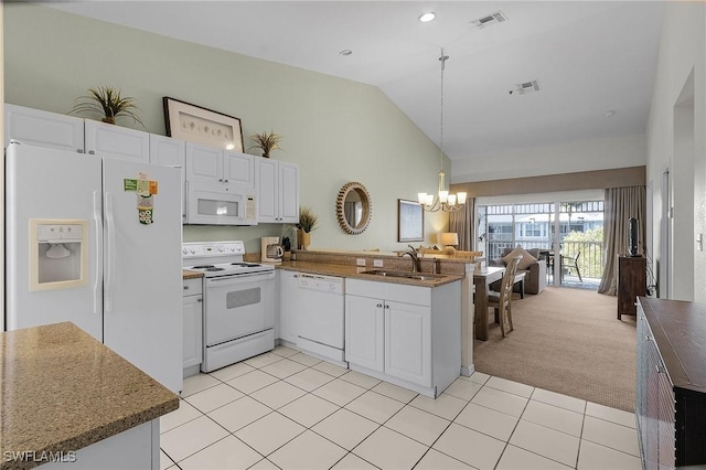 kitchen featuring kitchen peninsula, white appliances, light colored carpet, sink, and white cabinets