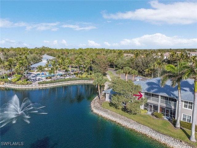 birds eye view of property with a water view