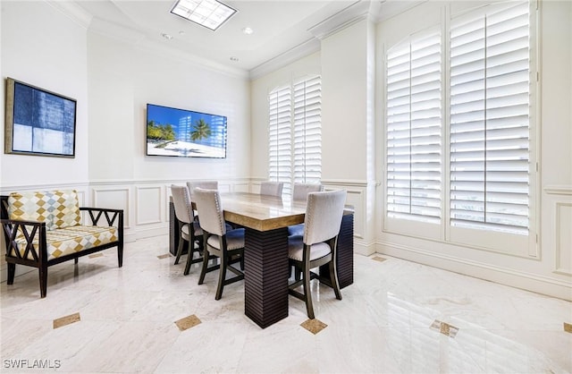 dining area with crown molding