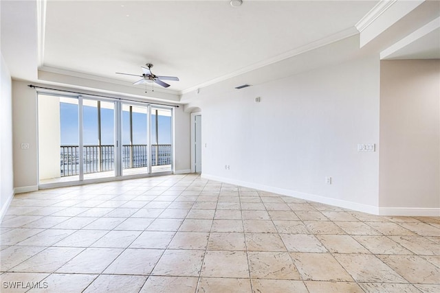 spare room featuring ceiling fan and crown molding