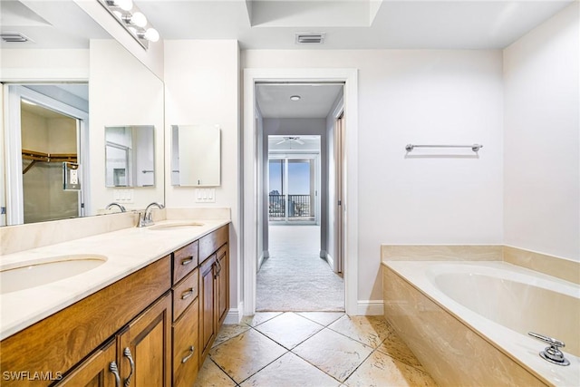 bathroom featuring a bathing tub and vanity