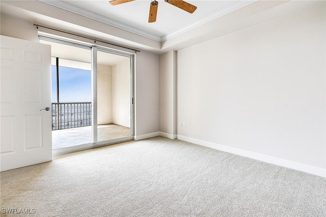 unfurnished room featuring ceiling fan, carpet floors, and crown molding