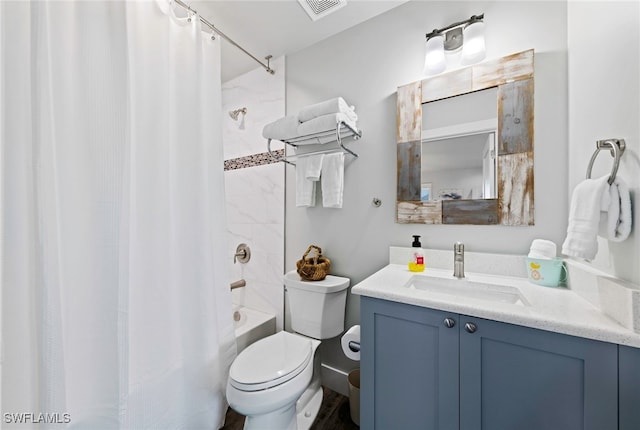 full bathroom with vanity, shower / bath combination with curtain, and toilet