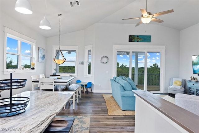 living room with ceiling fan, dark hardwood / wood-style flooring, and lofted ceiling