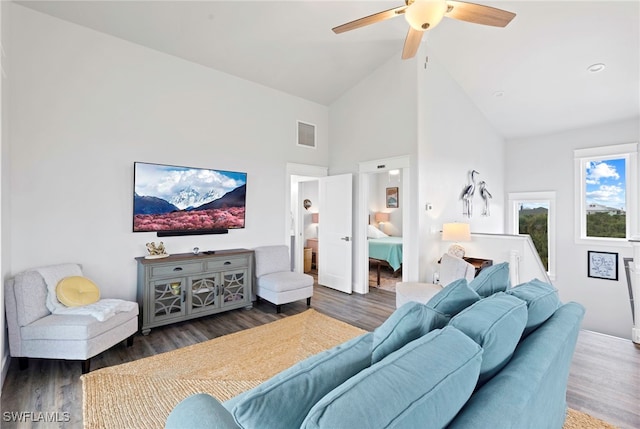 living room featuring ceiling fan, dark wood-type flooring, and high vaulted ceiling