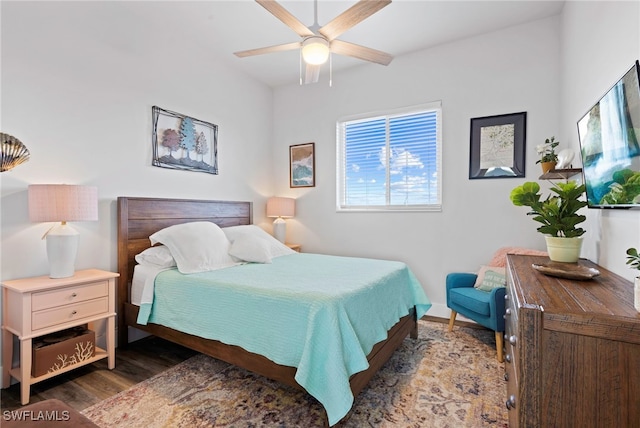 bedroom with ceiling fan and dark hardwood / wood-style flooring