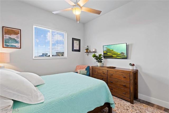 bedroom featuring ceiling fan and light hardwood / wood-style flooring