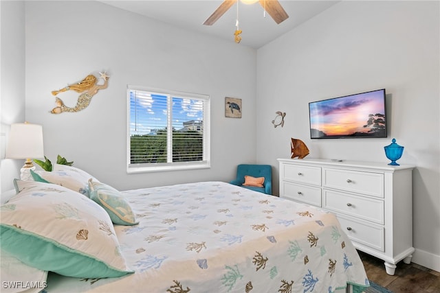 bedroom featuring ceiling fan and dark hardwood / wood-style floors