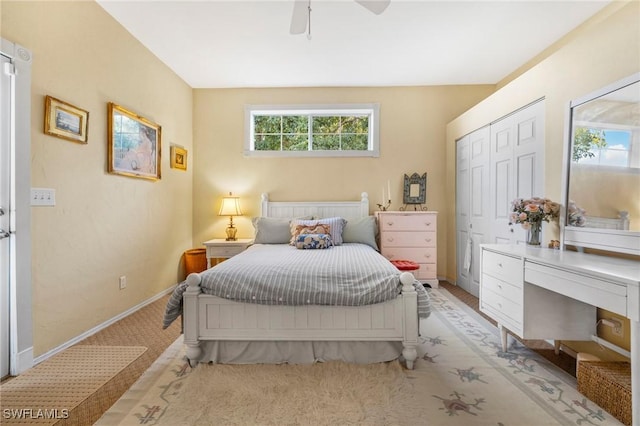 bedroom with ceiling fan and a closet