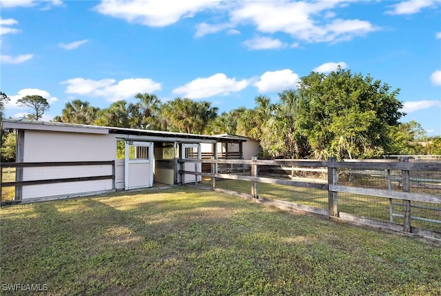 view of yard with an outdoor structure