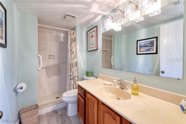 bathroom featuring a shower with curtain, vanity, hardwood / wood-style floors, and toilet