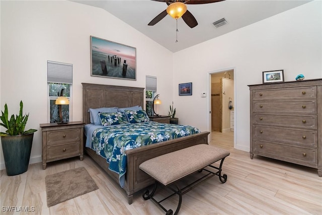 bedroom with ceiling fan, light wood-type flooring, and vaulted ceiling