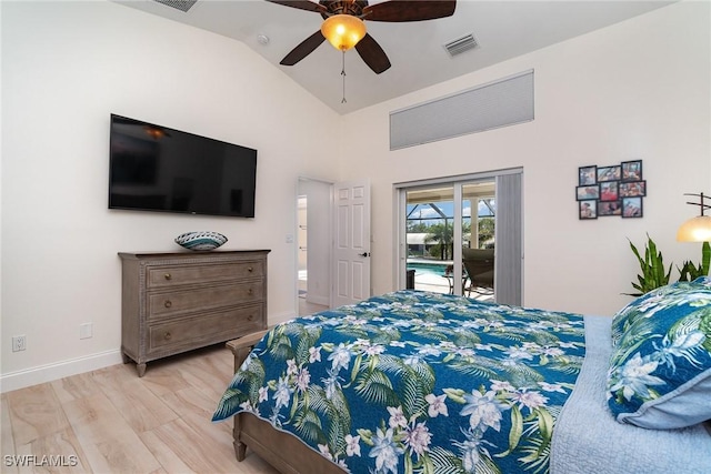 bedroom featuring ensuite bathroom, access to outside, vaulted ceiling, ceiling fan, and light hardwood / wood-style flooring