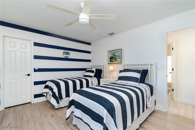 bedroom featuring ceiling fan and light hardwood / wood-style flooring