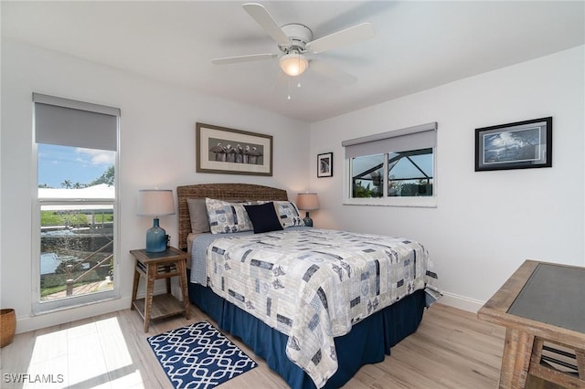 bedroom with hardwood / wood-style floors and ceiling fan