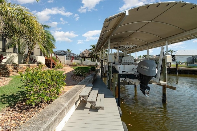 dock area with a water view