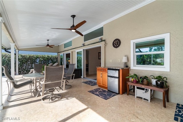 view of patio featuring ceiling fan