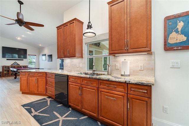 kitchen featuring dishwasher, vaulted ceiling, ceiling fan, decorative backsplash, and light hardwood / wood-style floors