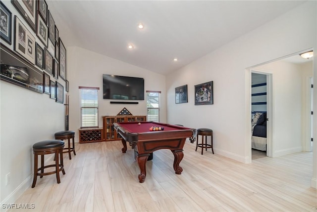 recreation room featuring light hardwood / wood-style floors, vaulted ceiling, and pool table