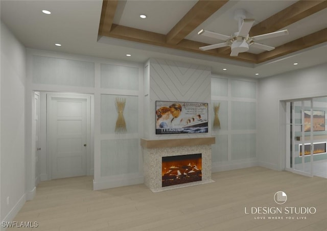 living room with beam ceiling, light hardwood / wood-style flooring, and ceiling fan