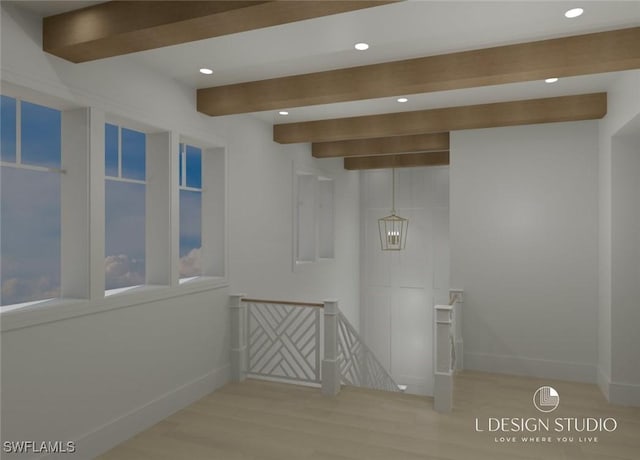 interior space featuring beam ceiling and light hardwood / wood-style floors