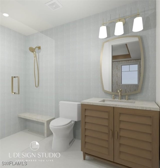 bathroom with vanity, toilet, tiled shower, and tile walls