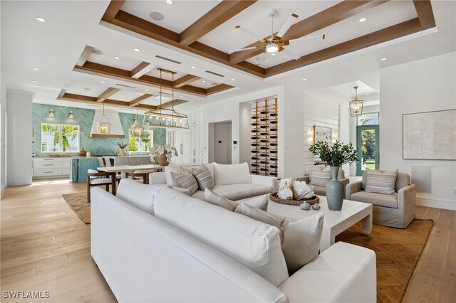187 10th Ave S, Naples, FL 34102 - living area featuring a chandelier, light wood finished floors, coffered ceiling, a ceiling fan, and beam ceiling