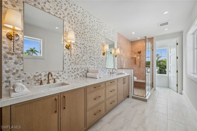 187 10th Ave S, Naples, FL 34102 - full bath with double vanity, a shower stall, decorative backsplash, and recessed lighting