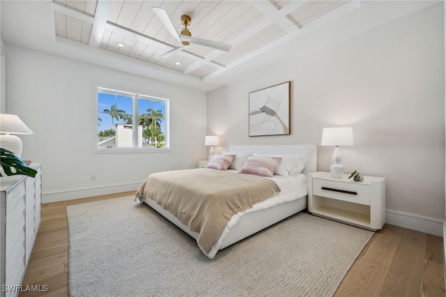 187 10th Ave S, Naples, FL 34102 - bedroom with light wood-style flooring, coffered ceiling, baseboards, beamed ceiling, and a ceiling fan