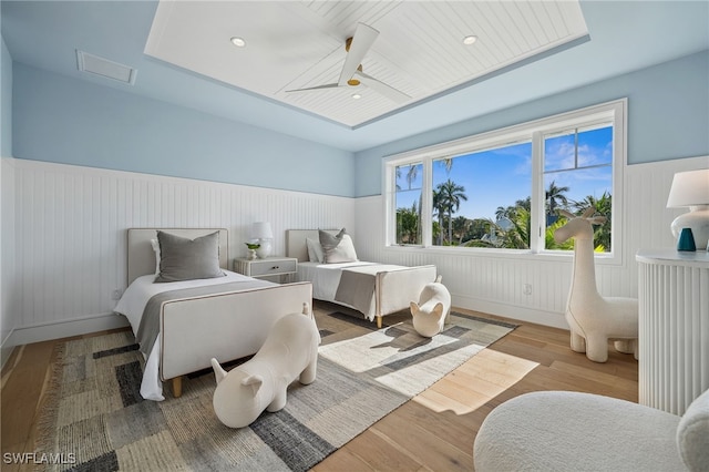 187 10th Ave S, Naples, FL 34102 - bedroom with wainscoting, wood finished floors, and recessed lighting