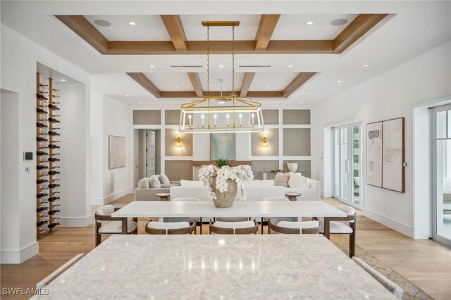 187 10th Ave S, Naples, FL 34102 - dining area with light wood-style floors, coffered ceiling, beam ceiling, baseboards, and a chandelier