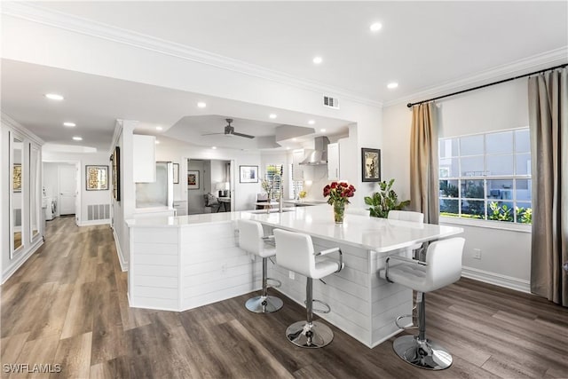 dining space featuring recessed lighting, dark wood finished floors, visible vents, and crown molding