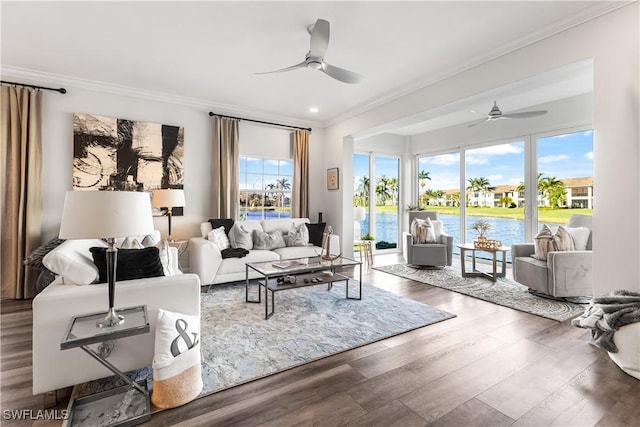 living area featuring ornamental molding, wood finished floors, and a ceiling fan