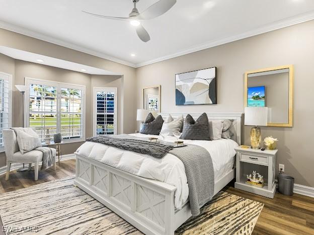 bedroom with recessed lighting, ornamental molding, ceiling fan, wood finished floors, and baseboards