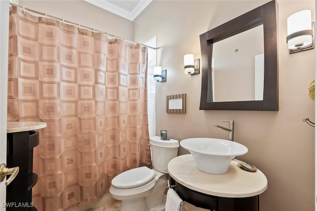 bathroom with vanity, crown molding, a shower with curtain, and toilet