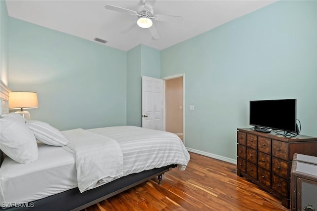 bedroom with hardwood / wood-style floors and ceiling fan