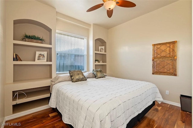 bedroom with dark wood-type flooring and ceiling fan