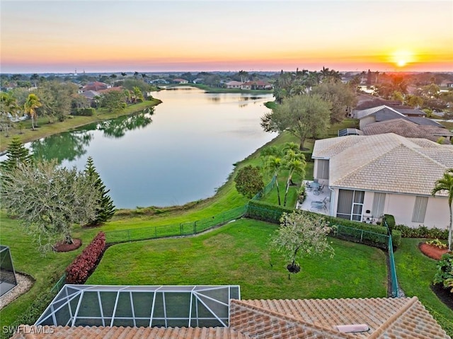 aerial view at dusk with a water view